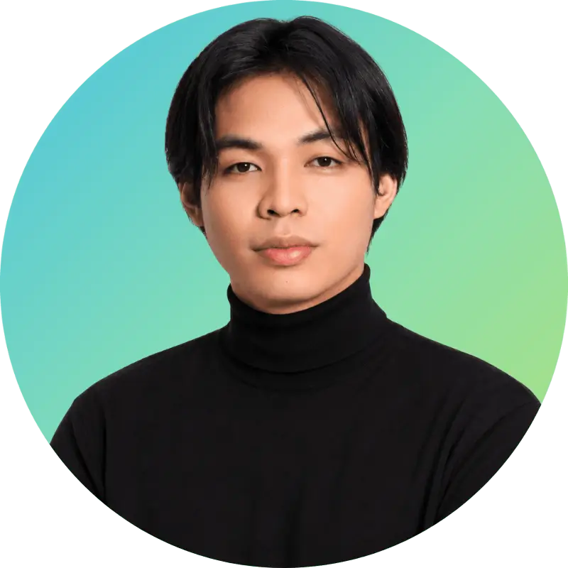 Carl, with straight dark hair in a black turtleneck, poses for his employee bio before a blue-green gradient background.